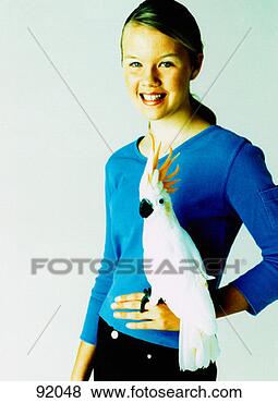 Stock Photo - teenage girl with 
cockatoo. fotosearch 
- search stock 
photos, pictures, 
images, and photo 
clipart
