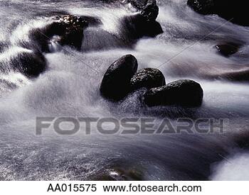 Stock Image - river flowing 
over rocks. fotosearch 
- search stock 
photos, pictures, 
images, and photo 
clipart