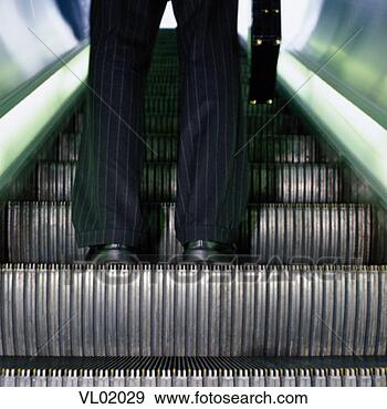 Stock Photograph - businessman riding 
an escalator. 
fotosearch - search 
stock photos, 
pictures, images, 
and photo clipart