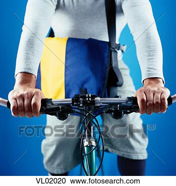 Stock Photography - close-up of a 
young man on a 
bicycle. fotosearch 
- search stock 
photos, pictures, 
images, and photo 
clipart