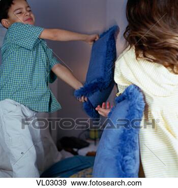 Stock Photograph - brother and sister 
having a pillow 
fight. fotosearch 
- search stock 
photos, pictures, 
images, and photo 
clipart