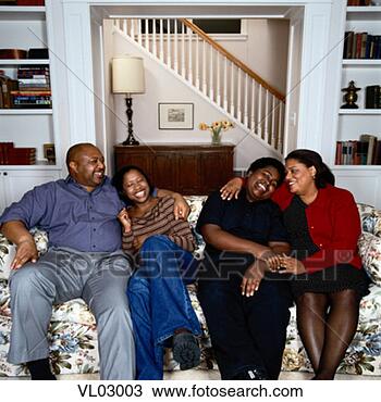 Stock Photo - family on a sofa. 
fotosearch - search 
stock photos, 
pictures, images, 
and photo clipart