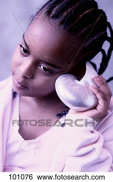 Stock Photo - girl listening 
to a sea shell. 
fotosearch - search 
stock photos, 
pictures, images, 
and photo clipart