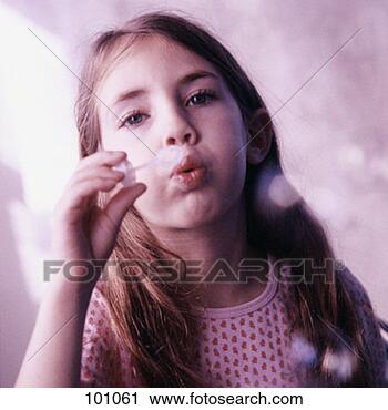 Stock Photography - portrait of a 
girl blowing soap 
bubbles. fotosearch 
- search stock 
photos, pictures, 
images, and photo 
clipart