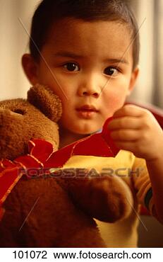 Stock Photo - toddler boy holding 
toy bear. fotosearch 
- search stock 
photos, pictures, 
images, and photo 
clipart