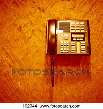 Stock Photo - phone on furry 
office wall. fotosearch 
- search stock 
photos, pictures, 
images, and photo 
clipart