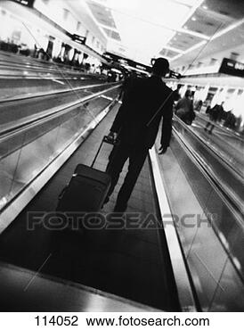 Stock Photo - businessman on 
moving walkway 
at airport. fotosearch 
- search stock 
photos, pictures, 
images, and photo 
clipart