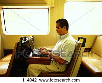 Stock Photo - man using laptop 
on subway. fotosearch 
- search stock 
photos, pictures, 
images, and photo 
clipart