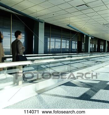 Stock Photography - two businessmen 
on a moving walkway 
in an airport. 
fotosearch - search 
stock photos, 
pictures, images, 
and photo clipart
