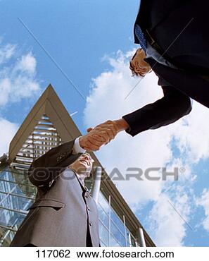 Stock Photo - two businessmen 
shaking hands. 
fotosearch - search 
stock photos, 
pictures, images, 
and photo clipart