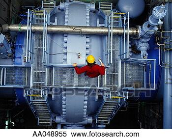 Stock Image - man inspecting 
valve at hydroelectric 
power station. 
fotosearch - search 
stock photos, 
pictures, images, 
and photo clipart