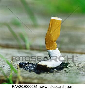 Stock Image - discarded cigarette 
butt on ground, 
close-up. fotosearch 
- search stock 
photos, pictures, 
images, and photo 
clipart