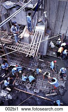 Stock Photography - workers working 
on a building`s 
foundations manila 
the philippines. 
fotosearch - search 
stock photos, 
pictures, images, 
and photo clipart