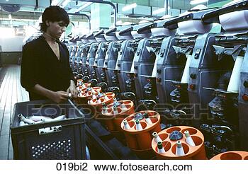 Stock Photo - worker at spinning 
machine in textile 
factory pakistan. 
fotosearch - search 
stock photos, 
pictures, images, 
and photo clipart