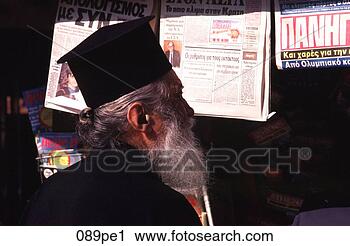 Stock Photography - old greek orthodox 
priest at news 
stand greece. 
fotosearch - search 
stock photos, 
pictures, images, 
and photo clipart