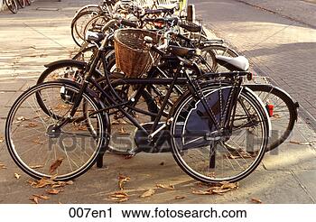 Stock Photography - bicycles chained 
to iron railings 
uk. fotosearch 
- search stock 
photos, pictures, 
images, and photo 
clipart