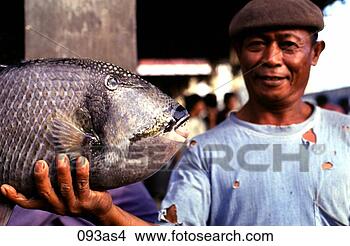 Stock Photo - man holding fish 
zamboanga the 
philippines asia. 
fotosearch - search 
stock photos, 
pictures, images, 
and photo clipart