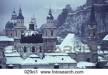Stock Photography - snow covered rooftops 
and baroque cathedral 
salzburg austria. 
fotosearch - search 
stock photos, 
pictures, images, 
and photo clipart
