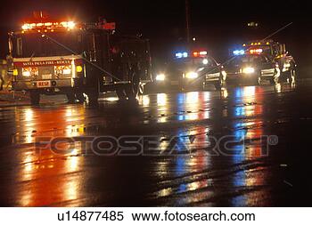Stock Image - emergency vehicles 
on a rainy night. 
fotosearch - search 
stock photos, 
pictures, images, 
and photo clipart