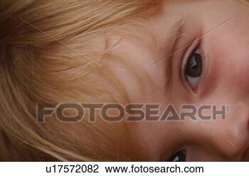 Stock Photo - close-up of a 
young girl looking 
at camera. fotosearch 
- search stock 
photos, pictures, 
images, and photo 
clipart