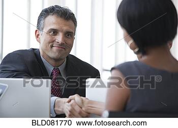 Smiling business people shaking hands in meeting
View Large Photo Image Stock Photography - smiling business
people shaking
hands in meeting.
fotosearch - search
stock photos,
pictures, wall
murals, images,
and photo clipart
