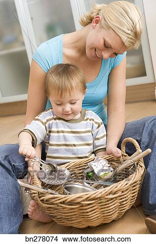 Stock Photo - mother and child 
playing with utensils. 
fotosearch - search 
stock photos, 
pictures, wall 
murals, images, 
and photo clipart