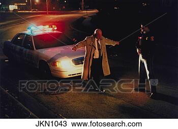 Stock Photo - police officer 
gives a drunk 
driver a sobriety 
test on the side 
of. fotosearch 
- search stock 
photos, pictures, 
wall murals, images, 
and photo clipart