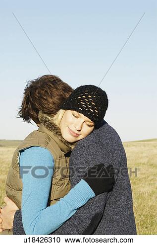 Stock Photography - embracing couple 
in countryside. 
fotosearch - search 
stock photos, 
pictures, wall 
murals, images, 
and photo clipart