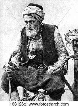 Stock Image - a peasant drinking  coffee and smoking  a huqqah, izmir,  turkey, 1936.  fotosearch - search  stock photos,  pictures, images,  and photo clipart
