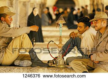 Stock Photo - men smoking a  hookah outside,  iran. fotosearch  - search stock  photos, pictures,  images, and photo  clipart