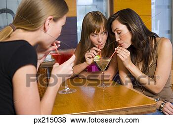 Stock Photo - women drinking martinis. fotosearch - search stock photos, pictures, wall murals, images, and photo clipart