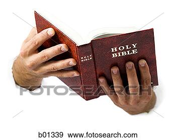 Stock Photograph of Close-up of hands holding the Bible b01339 - Search ...