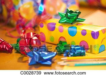 Stock Photograph - birthday still life of wrapped birthday presents with paper and bows. fotosearch - search stock photos, pictures, images, and photo clipart